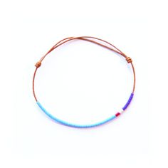 The bracelet is handmade. Small cylindrical glass beads threaded by hand, one at a time, onto the precisly fitting thread. The thread is a finely woven, waxed cotton twine. The colors assigned to each bracelet are a free interpretation between those of the national flag and the colors of the sports teams jerseys.  We recommend to verify the measure of the wrist. Hand Wrapped Beaded Bracelets For Friendship, Hand Wrapped Waxed Cord Friendship Bracelets, Friendship Bracelets With Adjustable Waxed Cord And Round Beads, Adjustable Waxed Cord Friendship Bracelets With Round Beads, Minimalist Beaded Bracelets With Sliding Knot, Minimalist Handmade Beaded Bracelets With Waxed Cord, Minimalist Beaded Bracelets With Adjustable Cord, Cotton Bracelet, Thread Bracelets