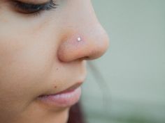 a close up of a woman's nose and nose with an acne on it