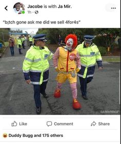 two men dressed as clowns walking down the street with people in yellow vests