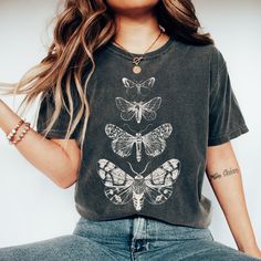 Looking for a shirt that fits your whimsical style? The Comfort Colors Cottage Core Moth Shirt is the perfect addition to your wardrobe! The celestial moth design is the epitome of goblincore and fairycore trends, and the oversized vintage fit adds a touch of comfort to your everyday outfits. Plus, it makes for a great gift idea for your fellow insect-loving friends. 💫T-SHIRT DETAILS Comfort Colors introduces its garment-dyed t-shirt; a fully customizable tee made 100% with ring-spun cotton. The soft-washed, garment-dyed fabric brings extra coziness to your wardrobe while the relaxed fit makes it an excellent daily choice. The double-needle stitching throughout the tee makes it highly durable while the lack of side-seams helps the shirt retain its tubular shape. .: 100% ring-spun cotton . Fairy Grunge Cotton Tops With Crew Neck, Fairy Grunge Short Sleeve Top With Screen Print, Fairy Grunge Crew Neck T-shirt Relaxed Fit, Fairy Grunge Relaxed Fit Crew Neck T-shirt, Cotton Fairycore T-shirt With Crew Neck, Summer Fairycore Crew Neck T-shirt, Cotton Fairycore Crew Neck T-shirt, Fairycore Cotton Crew Neck T-shirt, Crew Neck Cotton T-shirt In Fairycore Style