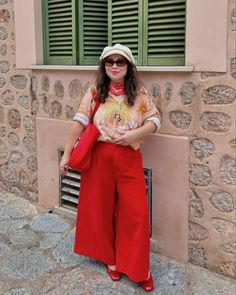 I may or may not have red as my fave color this fall♥️🍎🍁 Honeymoon continues with a day trip to Sóller🚂 Outfit deets: ♥️ pants: @gormanclothing *pr 🧡 shirt: @wild_paris *pr 🍎 mary jane shoes: @mango ❤️ scarf: @neverfullydressed ✨ ring: @anneday.nl *pr ♥️ bag: @polliepersonalised *pr #redoutfit #redaesthetic #allredeverything #colorfulstyle #coloraddict #fallcolors [red wide long pants, print shirt, red scarf, red Mary Jane shoes, red bag, colorful sunglasses, red aesthetic, red outfit, c... Red Culottes Outfit, Red Pants Outfit Street Style, Mary Jane Shoes Red, Fall Honeymoon, Red Culottes, Red Pants Outfit, Red Mary Jane Shoes, Culottes Outfit, Colorful Sunglasses