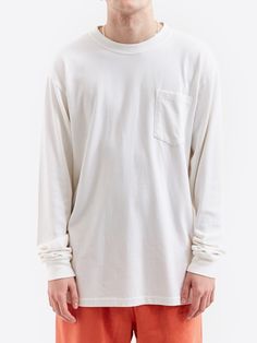 Elevate your basics with this Goodhood Worldwide crisp white long sleeve sleeve crewneck t-shirt, featuring a single breast pocket. 100% Cotton Garment Dyed 300 GSM Long Sleeve Crewneck *Model is 6'2" and wears a size Large *Womens Model is 5'10" and wears a size Small White Long Sleeve Top With Pockets, White Crew Neck Top With Side Pockets, Oversized Long Sleeve T-shirt With Pockets, White Tops With Side Pockets For Streetwear, Basic Crew Neck Sweatshirt With Pockets, White Cotton Sweatshirt With Side Pockets, White Soft-washed Long Sleeve T-shirt, White Long Sleeve Soft-washed T-shirt, Everyday Long Sleeve T-shirt With Pockets