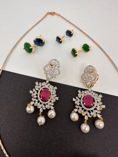 American Diamond Changeable Stones Pendent Set with matching Jhumki, comes with complementary ChainColor : Golden MatteSize : Mala Length : Approx 18 Inches; Pendent Length : Approx 2.75Inches; Earring Length : Approx 2 Inches;Stones : CZ Red Green Blue Stone Elegant Multicolor Sets With Latkans, Elegant Multicolor Jewelry Sets With Latkans, Antique Necklace Victorian, Pendent Set, Real Pearl Necklace, Ethnic Necklaces, Traditional Earrings, Kundan Necklaces, Oxidised Jewellery