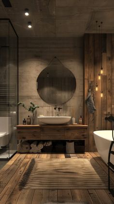 a bathroom with wooden floors and a round mirror