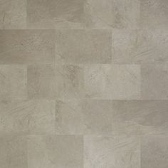 a tile floor with different shades of beige