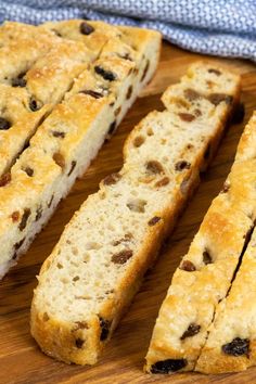 slices of bread sitting on top of a wooden cutting board