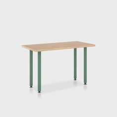 a rectangular table with green legs and a light wood top, against a white background