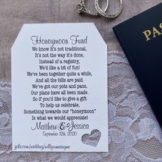 a passport, keychain and wedding vows on a lace tablecloth