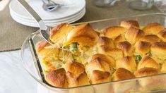 a casserole dish filled with bread and vegetables