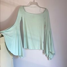 Free People Mint Off The Shoulder Shirt With Wide Flowy Sleeves. Elastic Around The Neckline So It Stays Up. Size Small. Never Been Worn, New With Tags. Blue Stretch Cotton Long Sleeve Top, Blue Cotton Stretch Long Sleeve Top, Fitted Bell Sleeve Cotton Tops, Stretch Long Sleeve Summer Tops, Summer Stretch Cotton Long Sleeve Top, Stretch Cotton Long Sleeve Top For Summer, Cotton Long Sleeve Summer Top, Blue Stretch Shirt For Fall, Cotton Bell Sleeve Tops For Fall