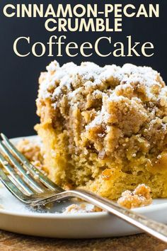 a close up of a piece of coffee cake on a plate with a fork in it