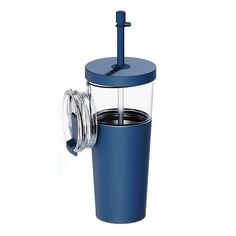 a blue glass cup with a lid and straw in front of the cup is filled with water