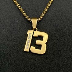 Get a custom number necklace with a personalized engraving. You can add a name, phrase, bible verse or anything else you would like to the back or front of the pendant. These make a great gift for athletes. Senior day, birthday, holidays. You name it and our engraved numbers are sure to be a hit! Made of durable stainless steel these pendants will never tarnish or fade! Each one is IP plated with 18K gold and gives a great look. Number jewelry is really popular with athletes right now so anyone Number Jewelry, Number Necklace, Stylish Fonts, Gold Number, Round Box, Stainless Steel Pendant, Steel Design, Box Chain, Stylish Accessories