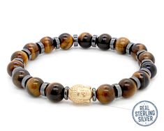 100% S999 Silver Buddha bead and Black Hematite with Tiger Eye Beads Bracelet. This yellow-brown tiger eye bracelet is an impressive unique gemstone combination complimented with Pure Silver Buddha Accented bead and Black Hematite spacer beads.  ❉  TIGER EYE  ❉     Eye of the tiger bracelet is said to protect the wearer during travel, lower high blood pressure and increase strength as these are benefits of tiger eye. The wearer of a tiger eye bracelet is thought to be ruled by the life-giving su Adjustable Polished Beads Bracelets For Meditation, Brown Bracelet With Spacer Beads For Gift, Brown Bracelet With Spacer Beads As Gift, Brown Bracelets With Spacer Beads As Gift, Brown Bracelets With Spacer Beads For Gifts, Buddha Bracelet Beads, Healing Stones Jewelry, Brown Tiger Eye, Buddha Beads