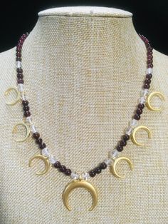 "Ancient style Lunula or Crescent moon necklaces with a variety of genuine gemstone options! Beautiful 22k gold plated pendants to compliment your ancient Roman, Greek, Parthian, Coptic or any other Bronze age persona! You can wear them with your prettiest T shirt and jeans outfit. Earrings that compliment these necklaces can be found in my Etsy shop here. https://www.etsy.com/listing/817662134/ancient-style-lunula-crescent-mooref=shop_home_active_2 These necklaces are finished with 14k gold fil T Shirt And Jeans Outfit, Shirt And Jeans Outfit, Gold Laurel Wreath, Moon Necklaces, Crescent Moon Necklace, Bronze Age, Wedding Jewellery Necklace, Jeans Outfit, T Shirt And Jeans