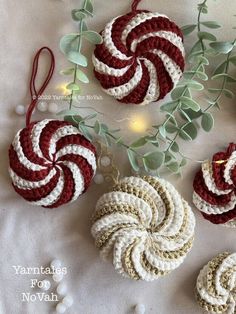 crocheted ornaments are arranged on a table