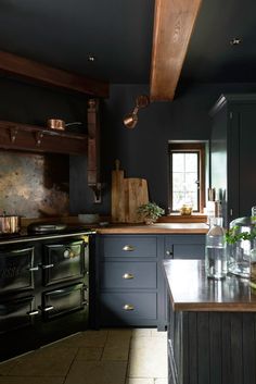 a kitchen with an oven, sink and counter tops in it's center island