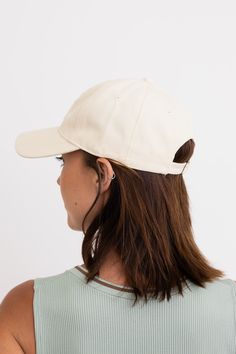 Add a touch of fun and happiness to your look with our Bow Ribbon Embroidered Baseball Cap! Made with comfy fabric and adorned with a cute and trendy embroidered bow, this cap is the perfect accessory for any casual outfit. Stand out in style and stay comfortable all day long. #lovemyleto 100% Cotton Imported Trendy Beige Baseball Cap With Curved Brim, Trendy Beige Baseball Cap With Curved Visor, Trendy Beige Baseball Cap For Everyday, Trendy Cream Baseball Cap With Curved Brim, Adjustable Cream Baseball Cap, Trendy Cotton Dad Hat With Visor, Trendy Cream Snapback Baseball Cap, Beige Visor Baseball Cap, One Size Fits Most, Trendy White Hat With Curved Visor