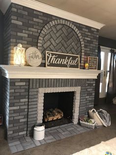 a brick fireplace with a sign that says, thank you're grateful on it