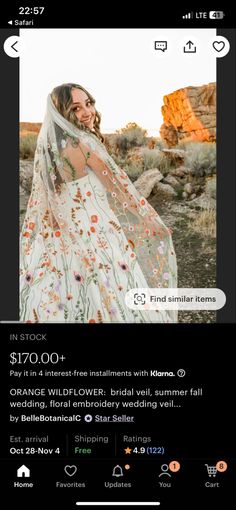 a woman in a white dress with an orange flowered shawl on her head