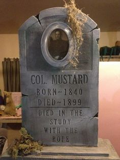 a tombstone with an image of a man in the hole on it's side