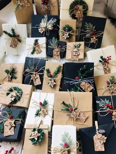 many presents wrapped in brown paper and tied with twine, holly wreaths and pine cones