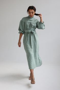 "Linen elegant dress with long wide sleeves, no shoulder line and delicate ruffle at the neck has tie detail in the back. Wide sleeves shrink with elastic at the bottom. Loose cut dress is comfy yet elegant and can be worn for various occasions. You can wear it without belt for romantic and free style or use belt to create more classic look. Belt is long enough to go around waist twice! For more chic look, style it with accessories. Double washed for extra softness and shrinkage prevention. ABOU