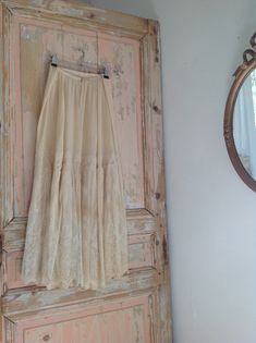 "antique chiffon gold beige petticoat skirt with a large flounce of Alencon lace the waist has a snap closure, condition : there is some discoloration, and the underlay of the lace part has several holes as you see in the last photo. measurements: waist 74 cm 29\" length 86 cm 34\" at the front length 90 cm 35' at the back" Beige Lace Long Skirt, Beige Flowy Lace Skirt, Beige Bottoms With Lace Trim Flowy Design, Sheer Lace Bottoms For Wedding, Sheer Lace Wedding Bottoms, Fitted Vintage Skirt With Lace Patchwork, Vintage Long Lace Skirt, Cream Lace Skirt With Ruffles, Cream Tiered Skirt With Lace Trim