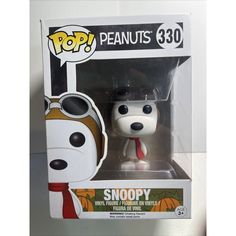 a pop vinyl figure in a box with a dog wearing sunglasses and a red tie