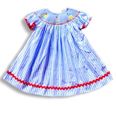 Fabric is cotton woven. Design is embroidered smocking. Dress fits true to size. Cotton Smocked Short Sleeve Dress For Daywear, Cotton Short Sleeve Smocked Dress For Daywear, Fitted Smocked Dress For Summer Playtime, Cute Smocked Dress For Dress-up, Cute Smocked Dress With Smocked Back For Playtime, Spring Cotton Smocked Dress With Lining, Spring Smock Dress For Dress-up, Spring Cotton Smocked Dress For Playtime, Cute Smocked Bodice Dress For Playtime