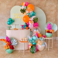 an assortment of balloons and decorations on display