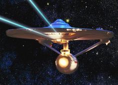 a star trek ship flying through the night sky