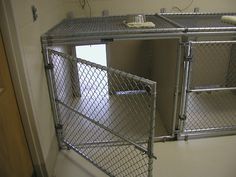 the inside of a jail cell with two doors open