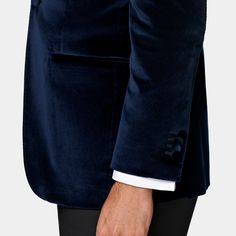 This navy dinner jacket is cut to a tailored fit, providing a slim chest and waist for a fitted silhouette and a natural shoulder design. It features a straight peak lapel, jetted pockets, and a half-canvas construction. Dinner Jacket, Unique Fits, Peak Lapel, Navy Blazer, Cotton Velvet, Fine Fabric, Shoulder Design, The Navy, Fitted Silhouette