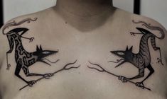 two black and white tattoos on the chest