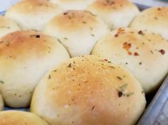 freshly baked bread rolls in a baking pan