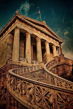 an old building with stairs leading up to it