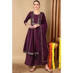 NOTE : If you see your size sold out, contact hi@thekurtalady.com and we will get it for you ! The Purple Silk Blend Embroidered Anarkali Suit Set is a stunning piece that is perfect for any special occasion. The suit is made from a luxurious silk blend fabric that is both soft and flowing. The anarkali kurta is embroidered with delicate floral patterns in contrasting shades of purple and pink. The set also includes a matching dupatta and palazzo pants. Fabric Info : Silk Blend Wash Care : Dry C Short Kurtis, Embroidered Anarkali, Dhoti Pants, Anarkali Kurta, Pants Fabric, Festive Wear, Anarkali Suit, Purple Silk, End Of Season Sale