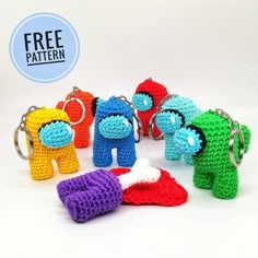 crochet keychains with different colors and shapes are shown in front of a white background