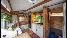 the interior of a tiny home with wood paneling