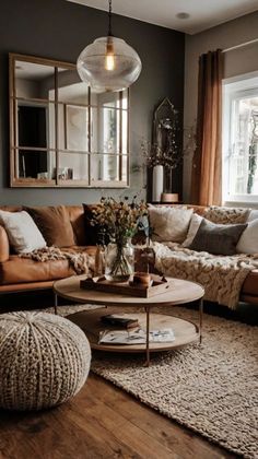 a living room filled with furniture and a large mirror on the wall over the couch