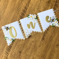 a banner with flowers and bees on it