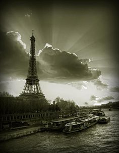 the eiffel tower towering over the city of paris, france in black and white