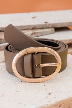 This versatile belt is perfect for high-rise outfits or everyday wear. The Classic Oval Belt has a wide width and adjustable buckle adds a chic touch. With a long length, it's the perfect one size fits all. Buckle: 2.5"x 2" Length: 41" Wide Leather Belt, Graphic Tee Dress, Sunglass Chain, Wall Accessories, Faux Leather Belts, Fashion Belts, Steel Necklace, Classic Leather, Belt Buckles