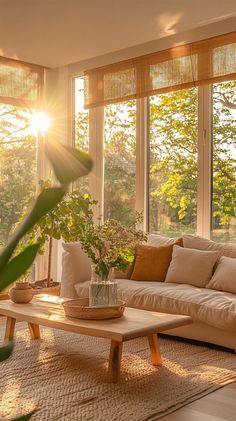 a living room filled with furniture and windows covered in sun shining through the window blinds