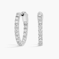 An elevated twist on a timeless piece, these 14k white gold diamond hoop earrings showcase 0.5 ct. tw. of prong-set round diamonds intricately arranged in an eternity-inspired design. Diameter of hoop measures 1/2 Inches. Gold Diamond Hoop Earrings, Diamond Hoop Earrings, White Gold Diamonds, Prong Setting, Timeless Pieces, Lab Grown, Lab Grown Diamonds, Round Diamonds, Gold Diamond