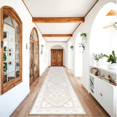 the hallway is clean and ready for us to use as an entrance way in this home