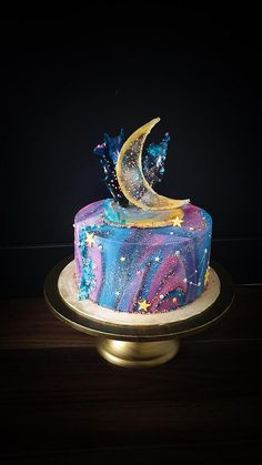 there is a cake with stars and the moon on it