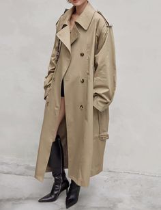 Oversized padded tan double-breasted trench coat . 100% cottonFit is oversized Waist tie belt Padded shoulders Bust 49"/ 126 cmTotal length 49"/124 cmModel is wearing one size and model's height is 5.6"/ 168 cmImported Oversized Double-breasted Khaki Outerwear, Oversized Long Belted Outerwear, Oversized Double-breasted Outerwear With Belted Cuffs, Oversized Belted Gabardine Outerwear, Oversized Beige Outerwear With Belted Cuffs, Oversized Belted Beige Outerwear, Oversized Beige Belted Outerwear, Pixie Market, Double Breasted Trench Coat