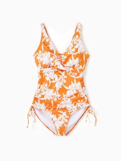 Family matching outfits with orange floral design, featuring drawstring swim trunks or a one-piece swimsuit with crisscross front and adjustable drawstring sides. Perfect for swimming, lounging at the pool or beach, and summer vacations.
* Please add each size separately to your shopping cart.
* Each size includes a one-piece swimsuit or a pair of swim trunks. 
* Drawstring swim trunks
* One-piece swimsuit with crisscross front design, removable pads, adjustable drawstring sides
* V-neck for women, round neck for girl
* Tight fit
* For pool, beach, vacation, and swimming
* Imported
* Supplier: PatPat Spring Swimwear With Side Ties For Sunbathing, Summer Swimwear With Side Ties For Vacation, Tropical Swimwear With Drawstring For Sunbathing, Orange Drawstring Swimwear For Vacation, Summer Swimwear With Side Ties For Swimming, Spring Vacation Swimwear With Side Ties, Orange Floral Print Swimwear, Drawstring One-piece Swimwear For Beach Season, One-piece Swimwear With Drawstring For Beach Season